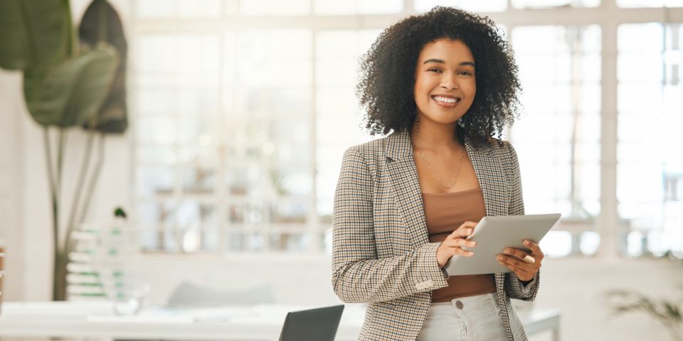 businesswoman on tablet in office