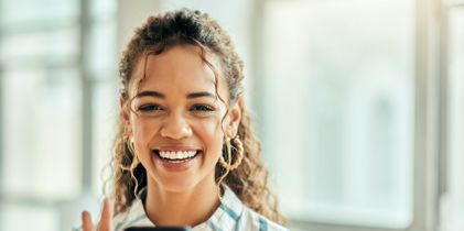 Smiling woman on mobile phone