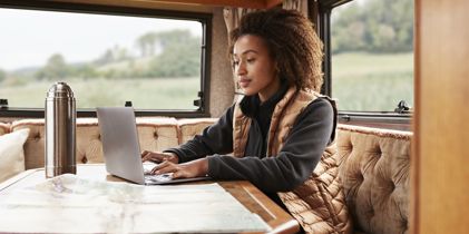 lady on laptop in camper