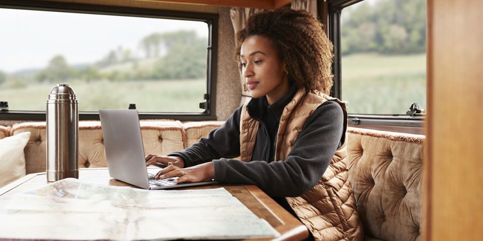 lady on laptop in camper