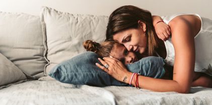 mother and daughter on a couch