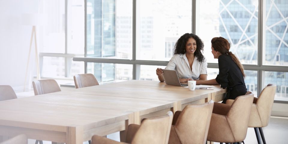 2 people sitting at large table