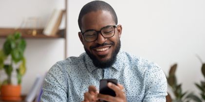 Man on his phone smiling