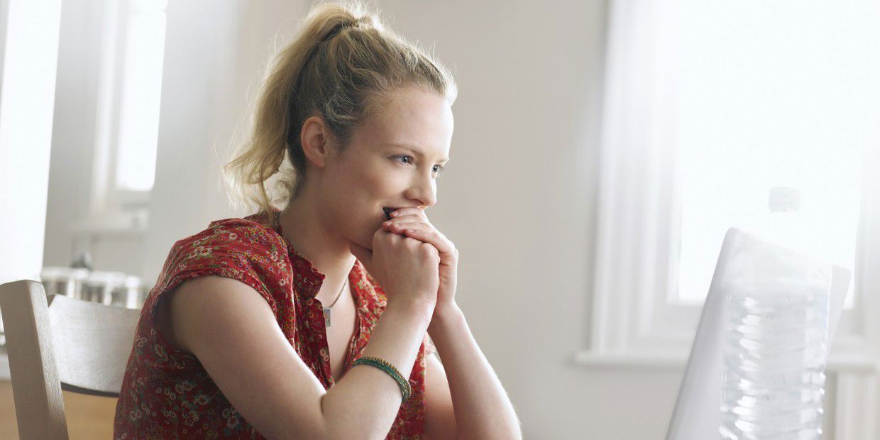 woman looking at computer monitor