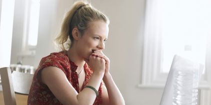 woman looking at computer monitor