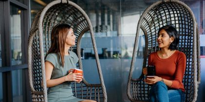 Two women sitting and drinking coffee