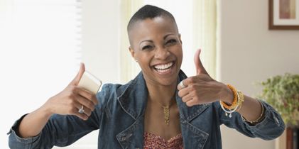 Happy woman with thumbs up