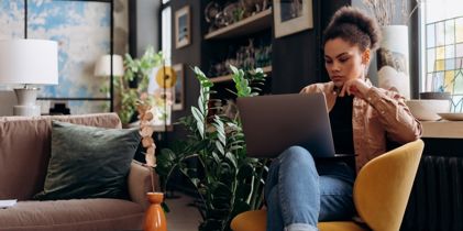 Serious woman looking at laptop