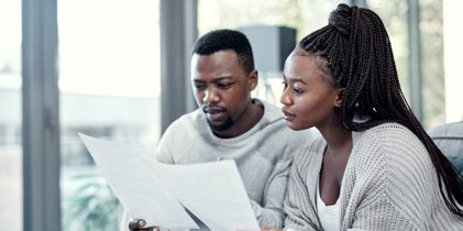 Serious couple looking at documents