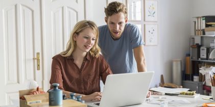 Couple looking at laptop