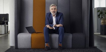 Businessman sitting with laptop