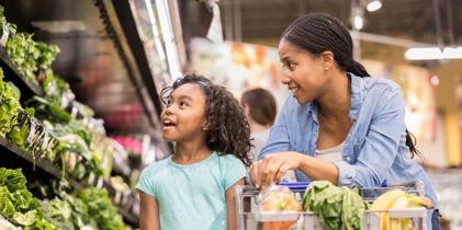 Mother and daughter grocery shopping