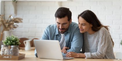 Couple looking at laptop