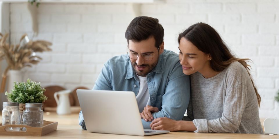 Couple looking at laptop