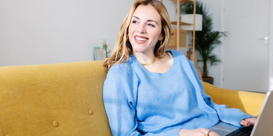 smiling woman on couch
