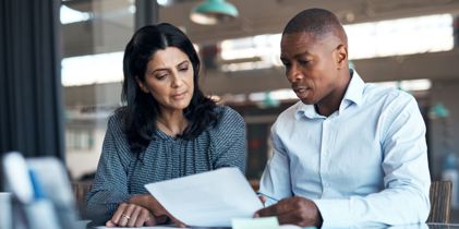 two people discussing document
