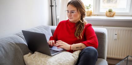 woman on laptop on couch