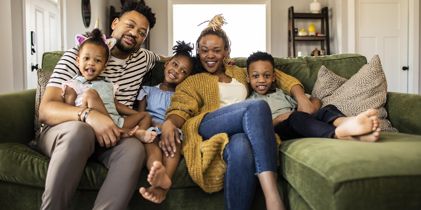 family sitting on couch