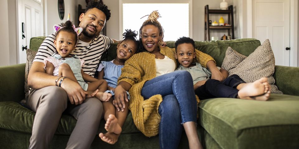 family sitting on couch
