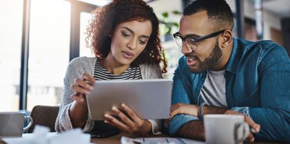 couple looking at tablet