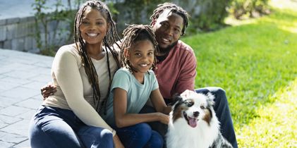 family outside with dog