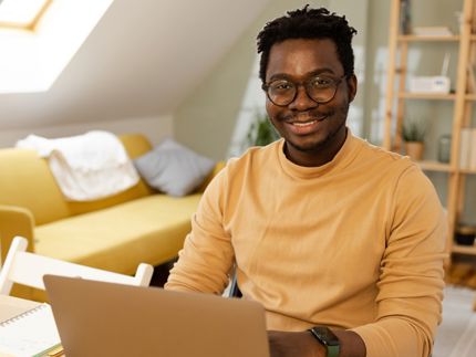 man on laptop at desk