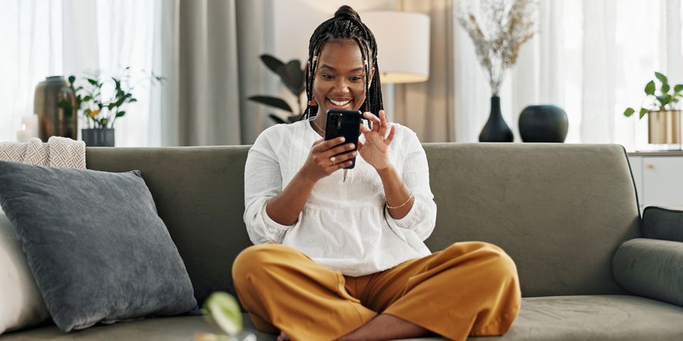 Happy young woman on cellphone