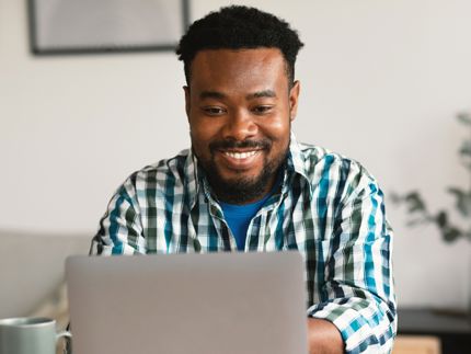 Happy man on laptop
