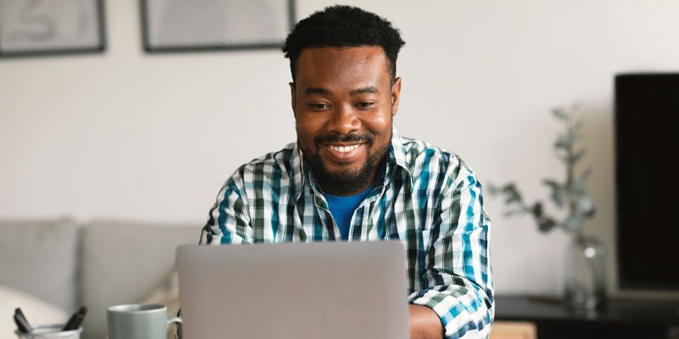 Happy man on laptop