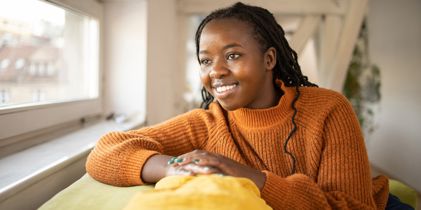 young woman looking out the window