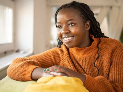 young woman looking out the window
