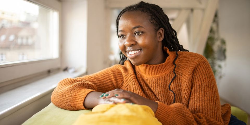 young woman looking out the window