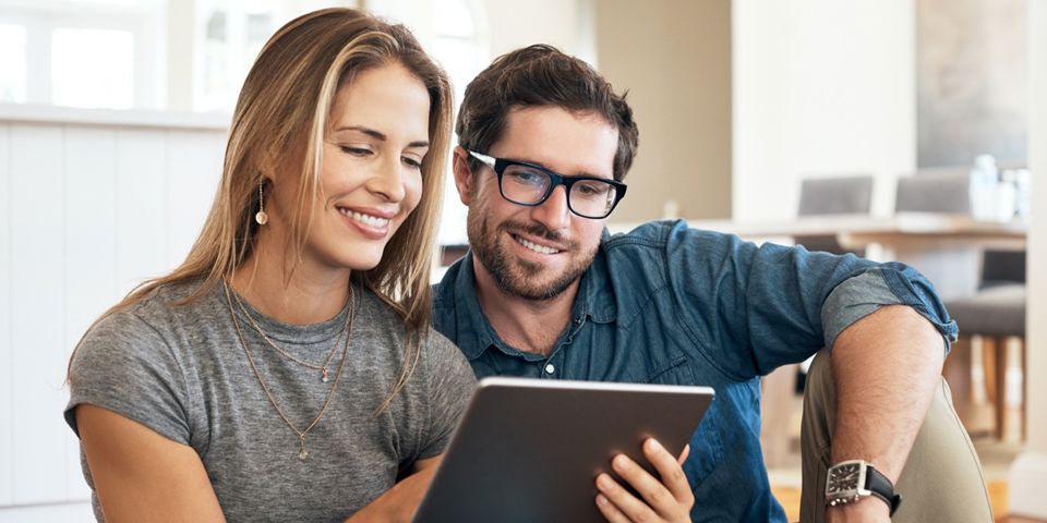 couple looking at tablet