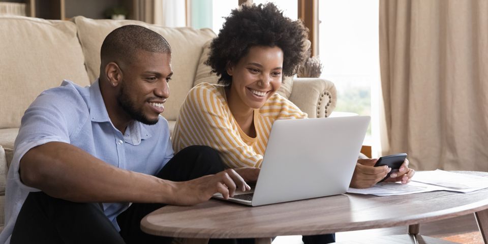 young couple using laptop