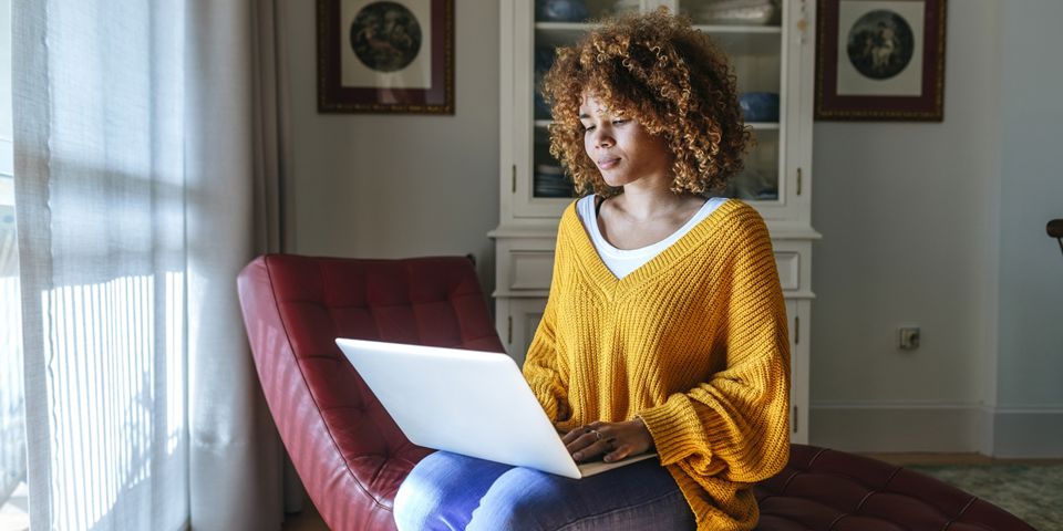 woman looking at laptop
