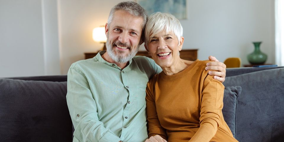 old couple sitting on couch