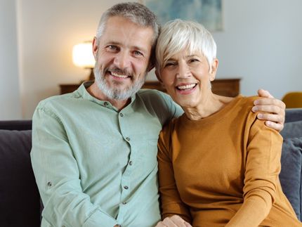 old couple sitting on couch