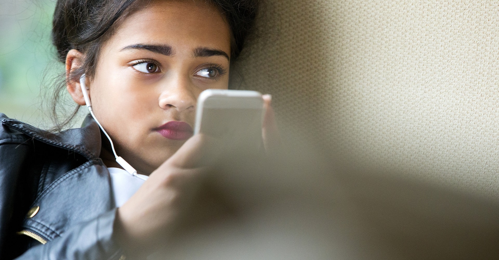 teenager looking at cellphone