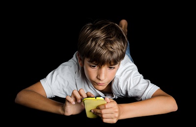 Kid playing with phone