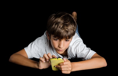 Kid playing with phone
