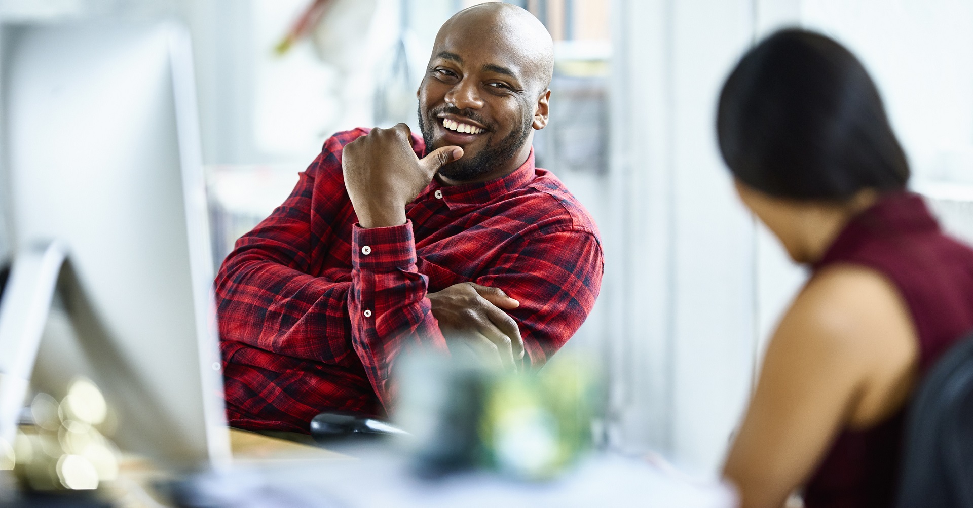 happy man sitting at desk