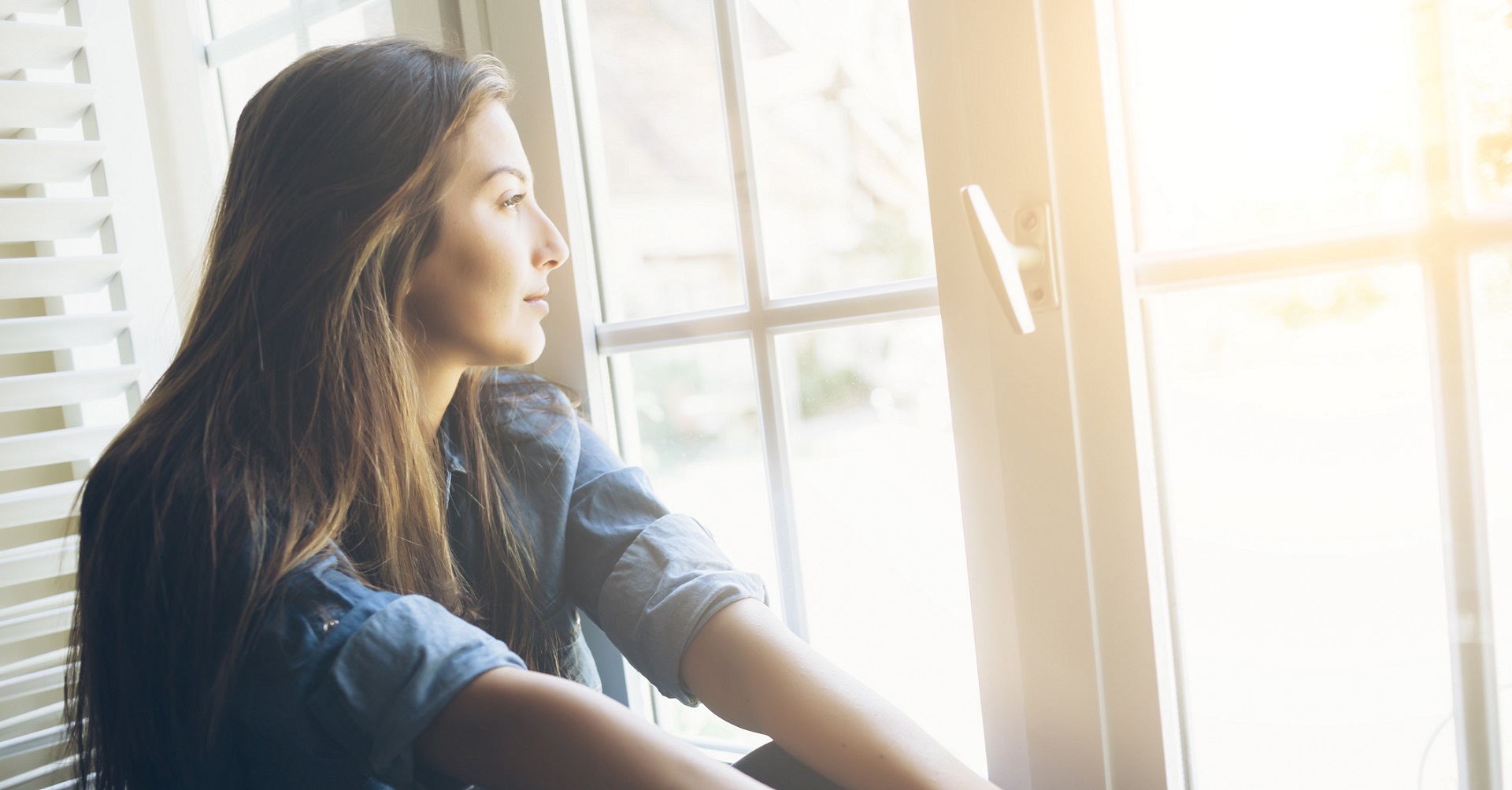 woman looking out the window