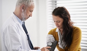 woman getting check up at doctor