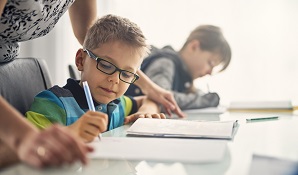 mother helping child with school work