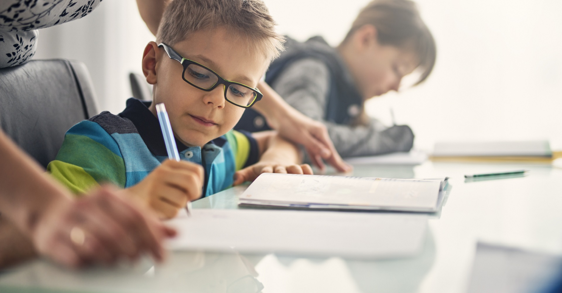 mother helping child with school work