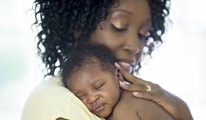 mother holding new born baby