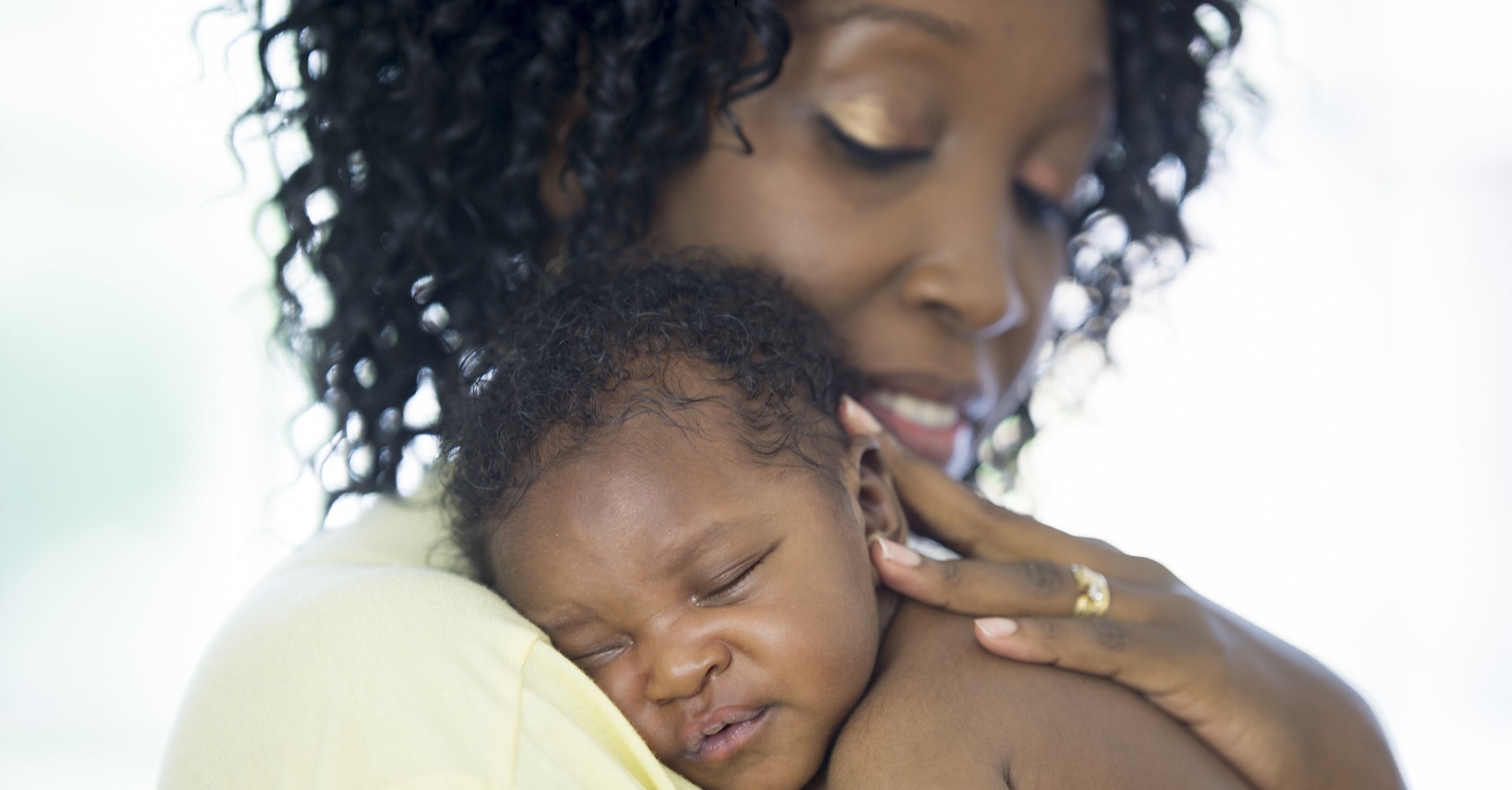 mother holding new born baby