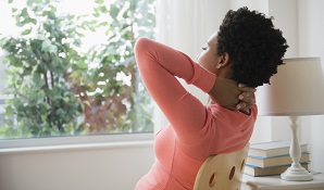 woman looking out window