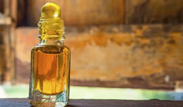 bottle of oil on a wooden table