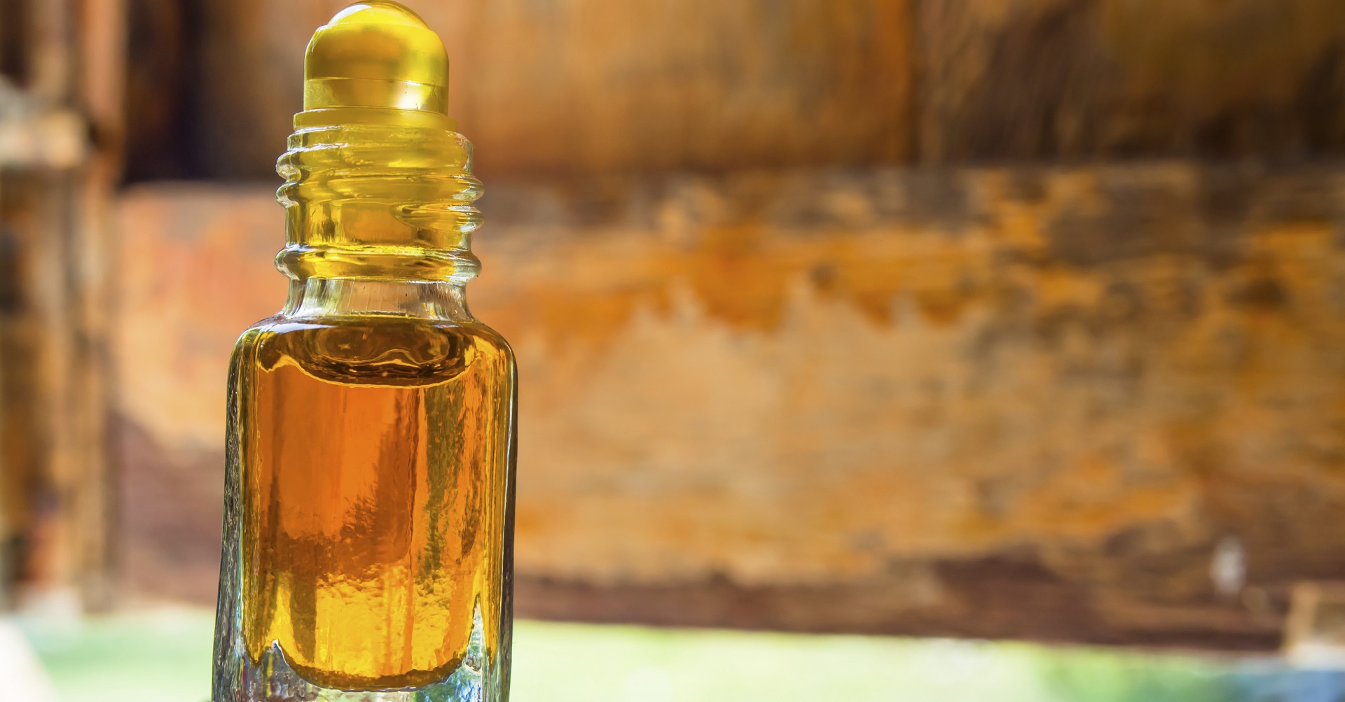 bottle of oil on a wooden table